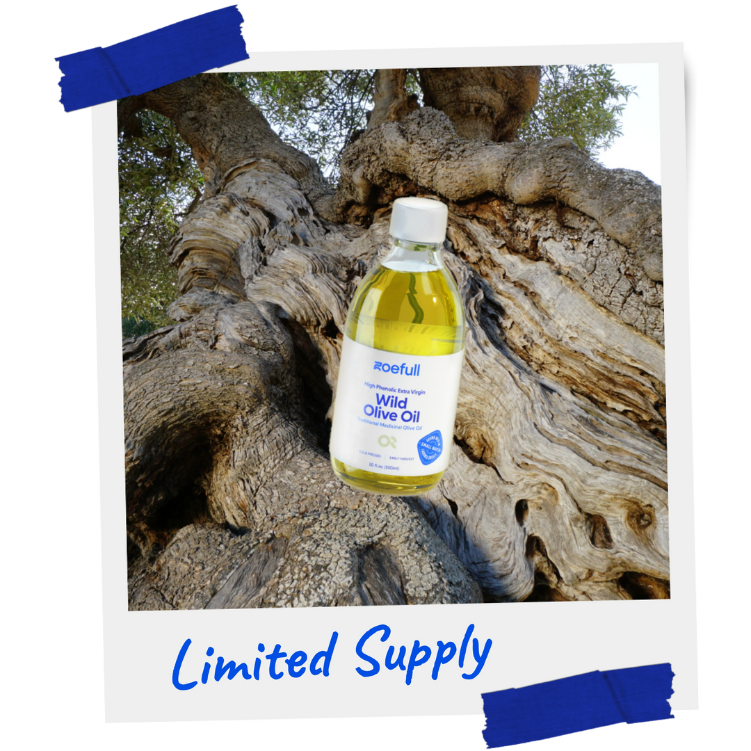 A design image of zoefull's wild olive oil in front of an ancient wild olive tree. Limited Supply.
