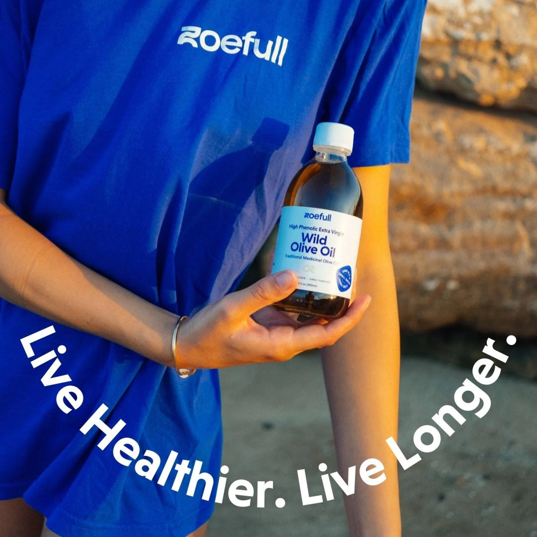 A lifestyle photo of a woman holding zoefull's wild olive oil saying ''Live Healthier. Live Longer.''